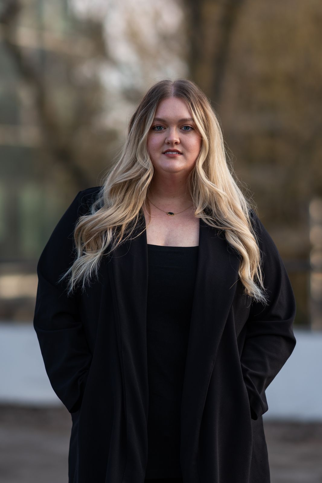 Young woman in a black coat in an outdoor portrait